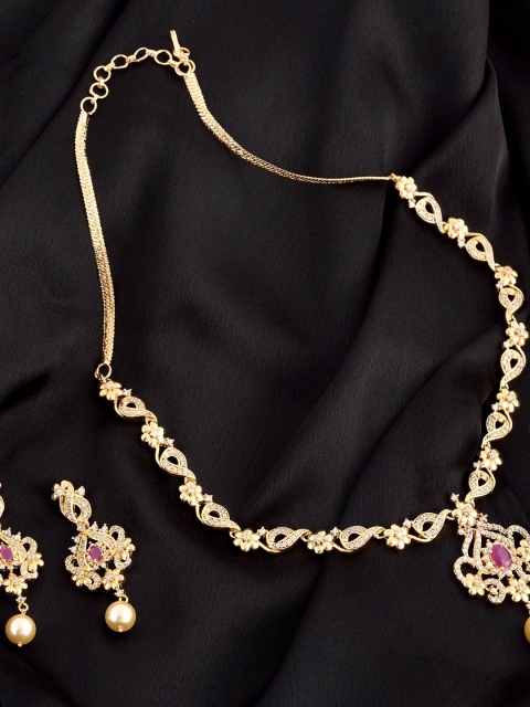 

Saraf RS Jewellery Gold-Plated White & Red AD-Studded Handcrafted Jewellery Set