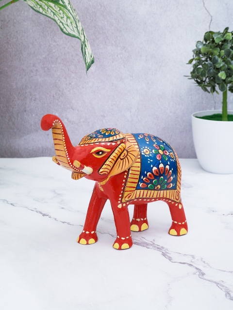 

Golden Peacock Red & Blue Handcrafted Elephant Showpiece