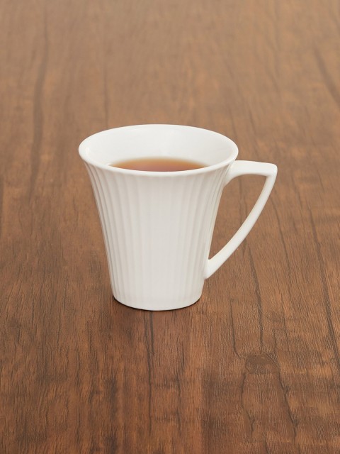 

Home Centre White Solid Ceramic Glossy Cup And Saucer Set