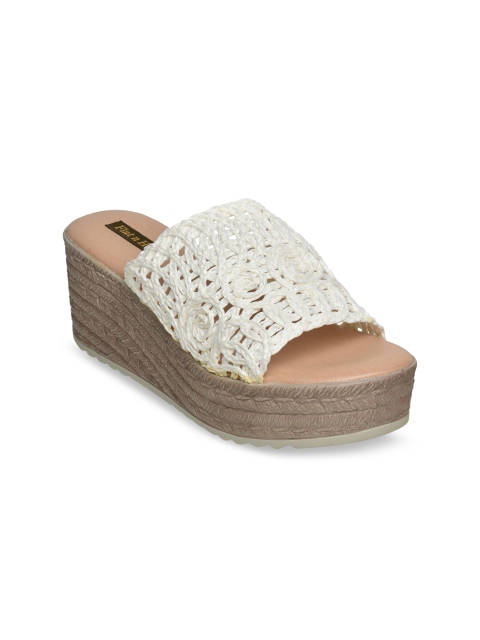 

Flat n Heels White Wedge Mules with Laser Cuts