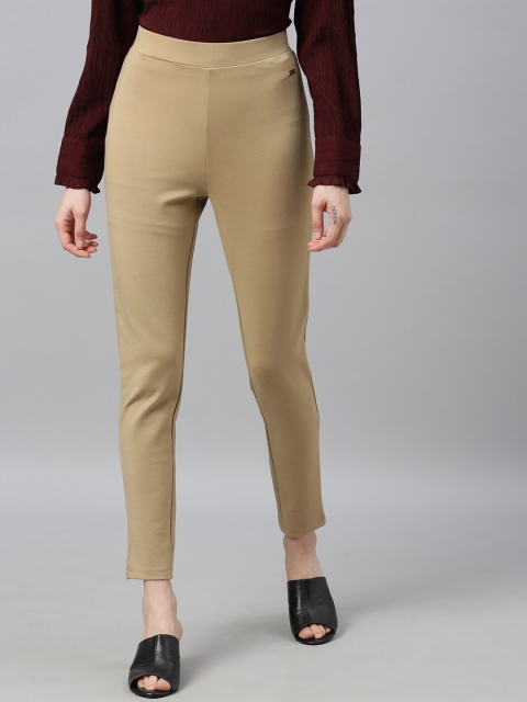 

Park Avenue Woman Women Beige Solid Jeggings