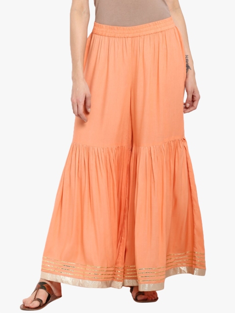 

KSUT Women Peach Flared Ethnic Palazzos