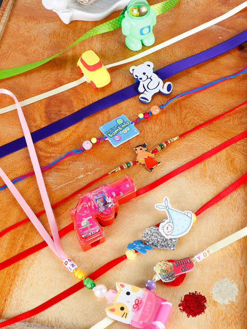 

PASSION PETALS Boys Multicoloured Set of 9 Rakhi Set With Roli Chawal And Card, Multi