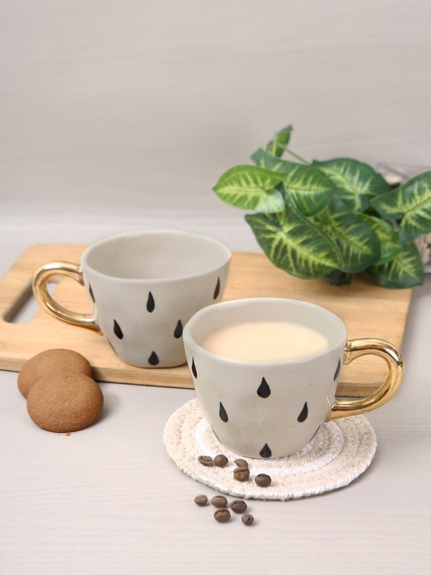 

Aapno Rajasthan Set Of 2 Off-White & Black Printed Ceramic Glossy Mugs