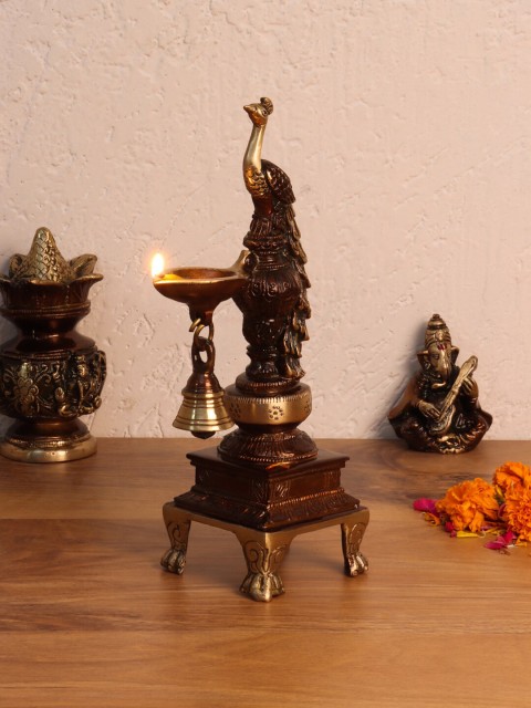 

Aapno Rajasthan Brown Standing Peacock Oil Lamp