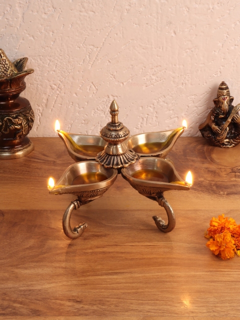 

Aapno Rajasthan Brown Brass Lamp with Four Slots
