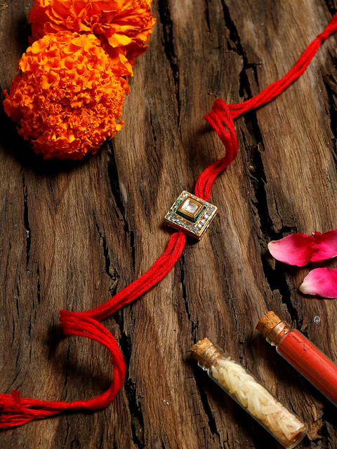 

Ruby Raang Red & Gold-Coloured Kundan Rakhi Gift Box