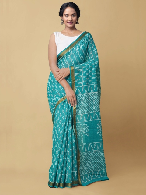 

Unnati Silks Turquoise Blue & White Ethnic Motifs Pure Cotton Dabu Saree