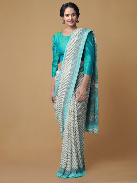 

Unnati Silks White & Turquoise Blue Floral Patola Saree