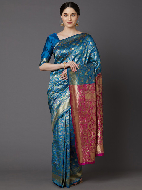 

Mitera Teal & Pink Woven Design Zari Silk Blend Banarasi Saree