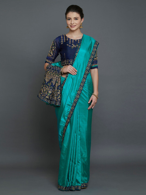 

Mitera Teal & Navy Blue Floral Zari Silk Blend Saree