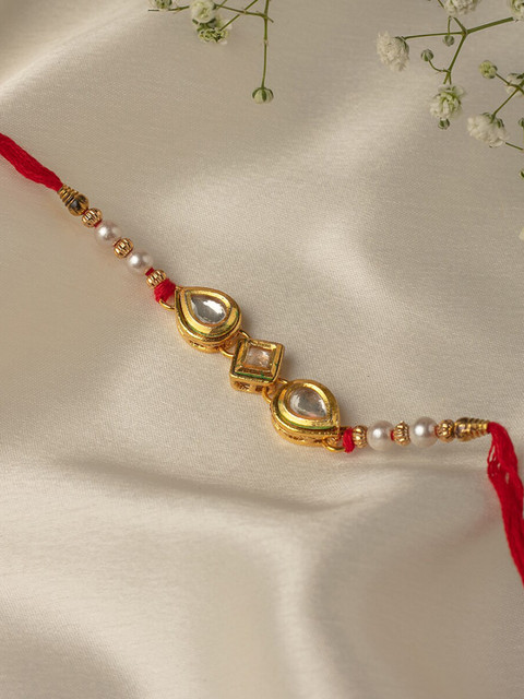 

Zaveri Pearls Red & Gold-Toned Kundan & Beaded Traditional Rakhi
