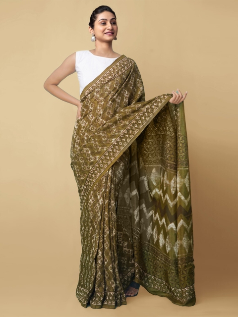

Unnati Silks Olive Green & White Floral Art Silk Dabu Saree