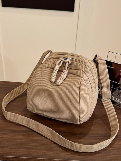 StyleCast x Revolte Structured Sling Bag