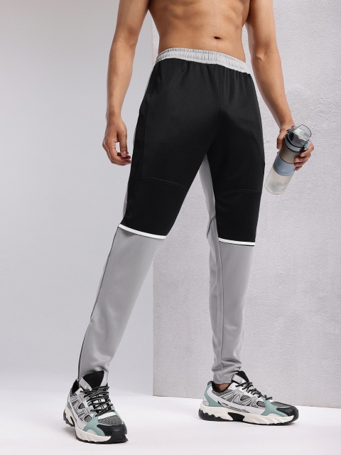 HRX by Hrithik Roshan Men Colourblocked Zipped Hem Rapid-Dry Running Track Pants