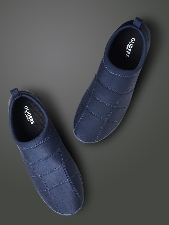 Men Blue Solid Slip-On Sneakers deal from myntra