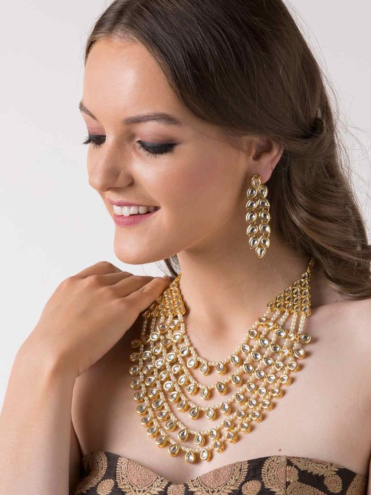 Gold-Toned & White Kundan & Pearl Layered Jewellery Set