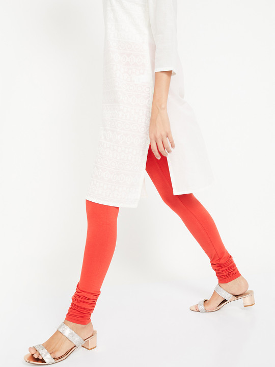 Women Orange Solid Slim Fit Churidar Leggings