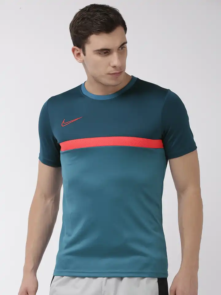 teal and orange nike shirt