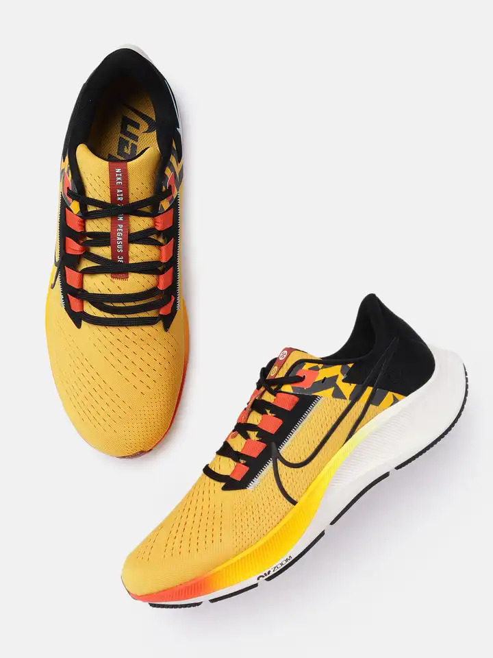 black and yellow nikes women