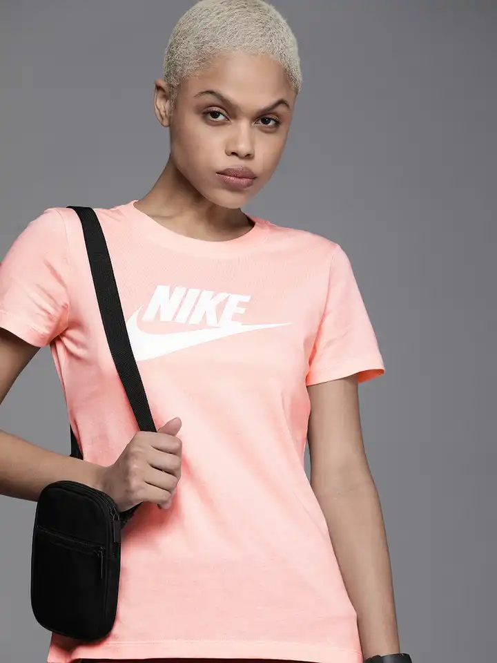 white and peach nike shirt