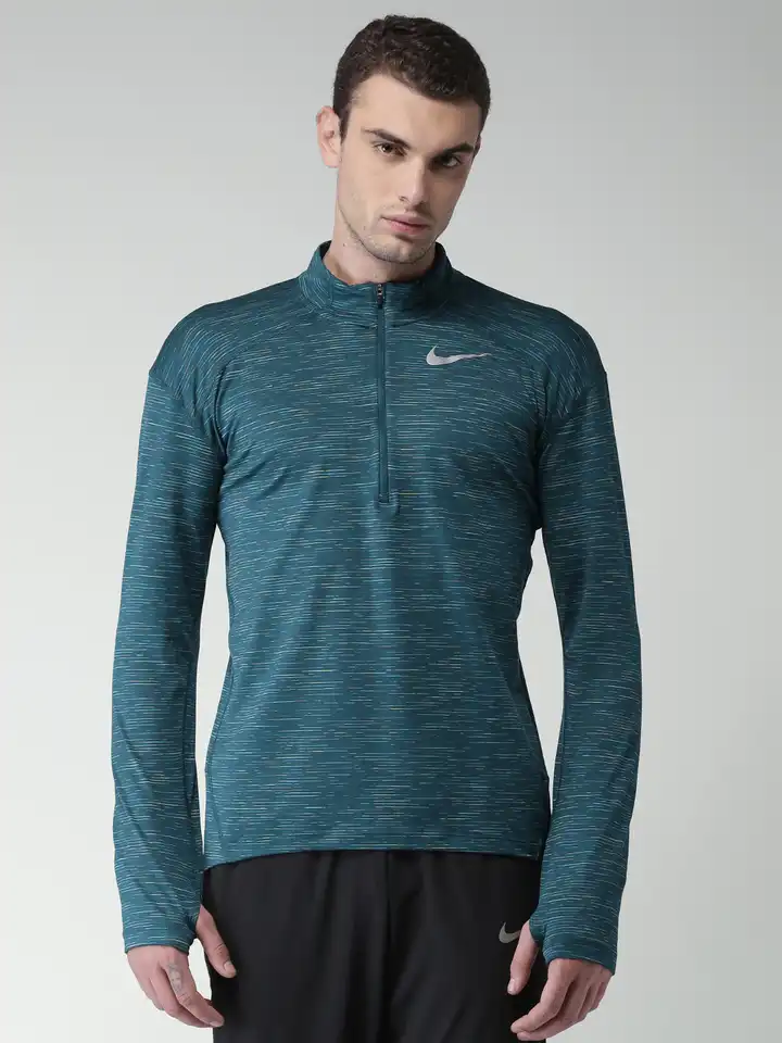 teal and black nike shirt