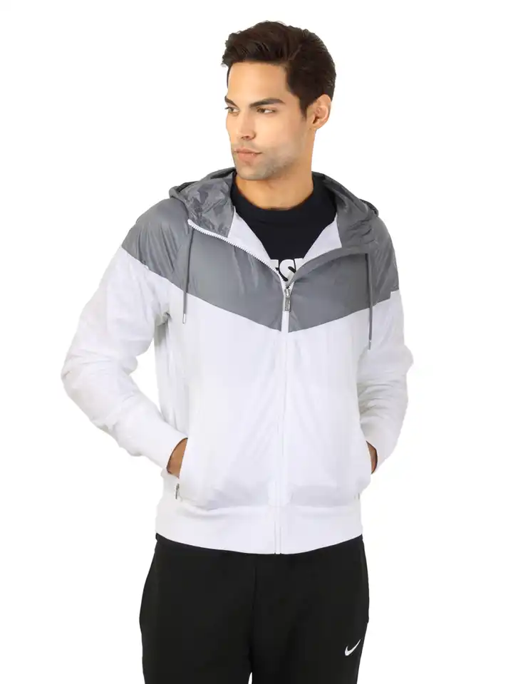 white and silver nike windbreaker