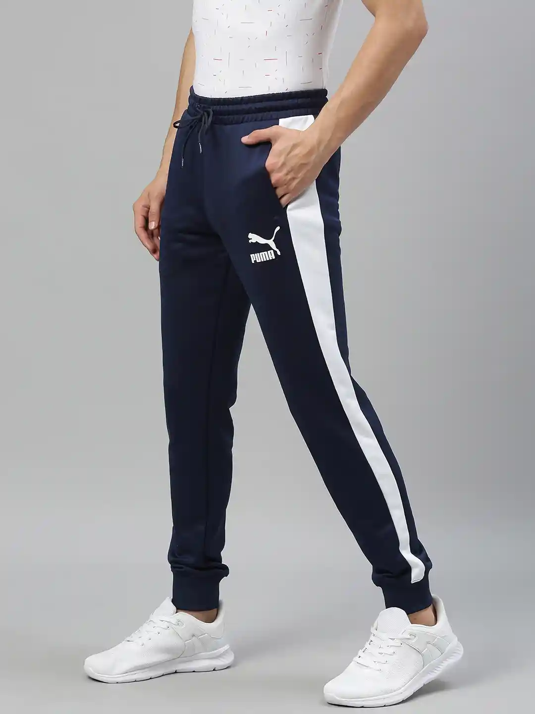 Buy Puma Men's Navy Blue Solid Sustainable TrackSustainable Pants with Side  Stripes - Track Pants for Men 12649714 | Myntra