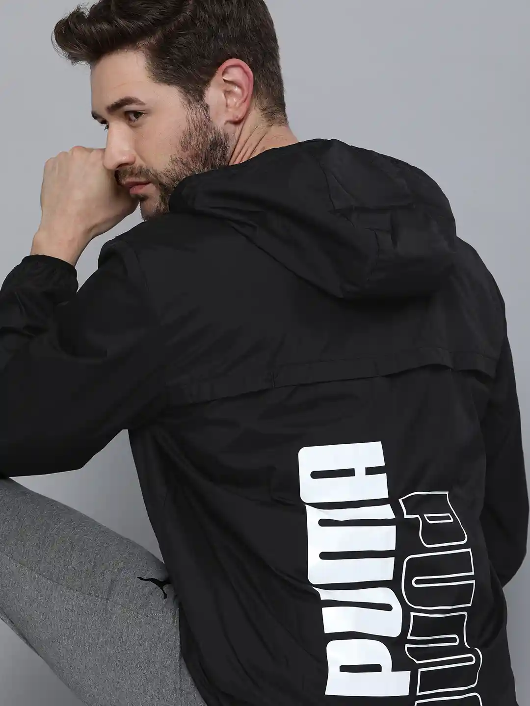Buy Puma Men Black Logo Essential Graphic Regular Fit Windbreaker - Main Image