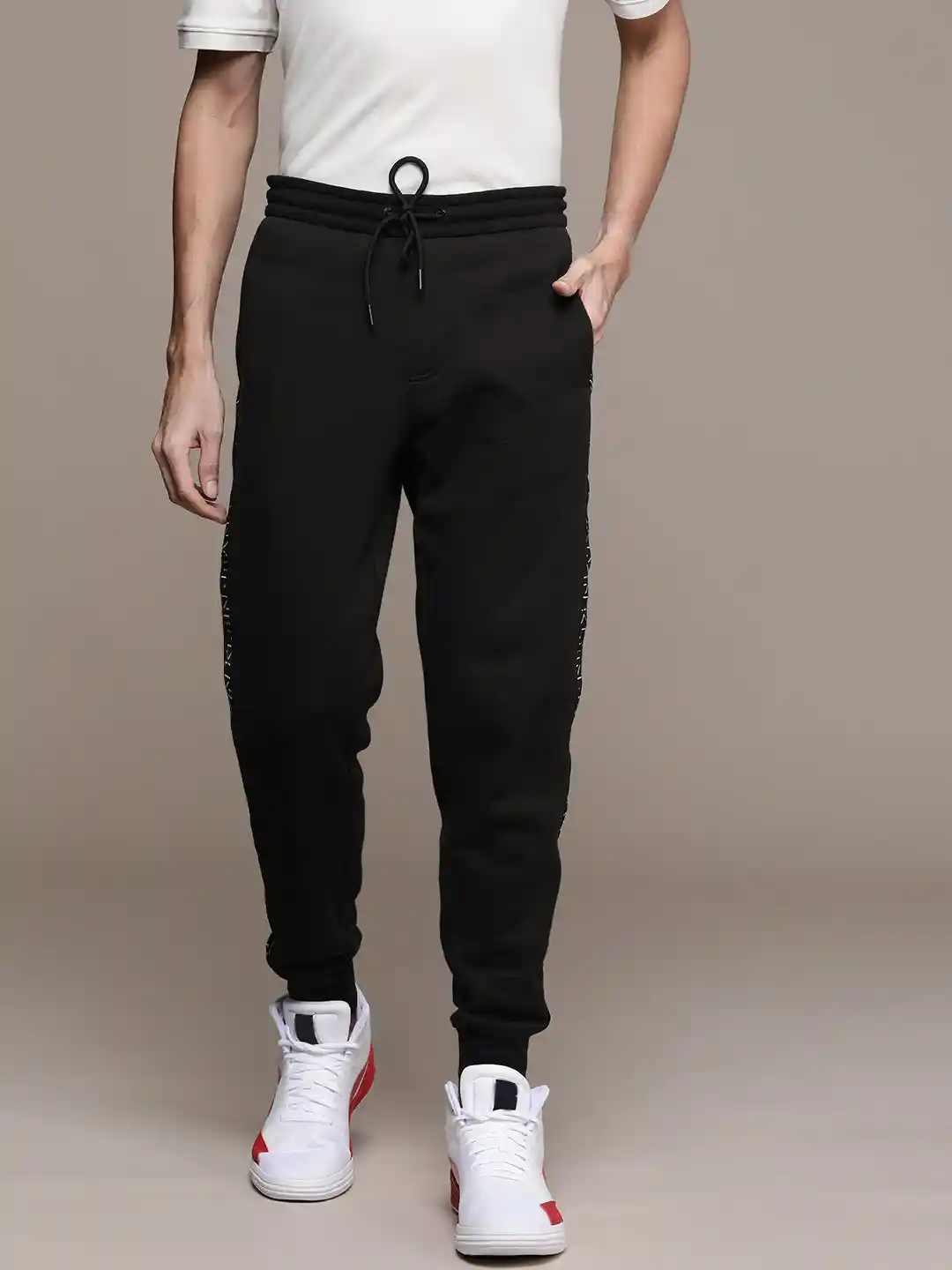 Buy Calvin Klein Jeans Men Black Solid Side Logo Taped Joggers