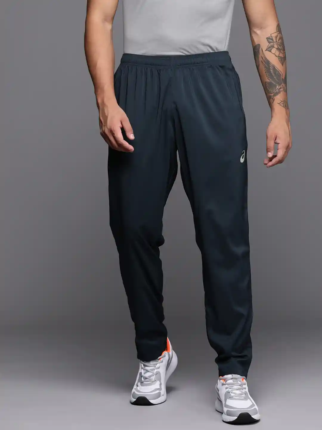 Buy ASICS Men Zip Bottom Woven Solid Running Track Pants