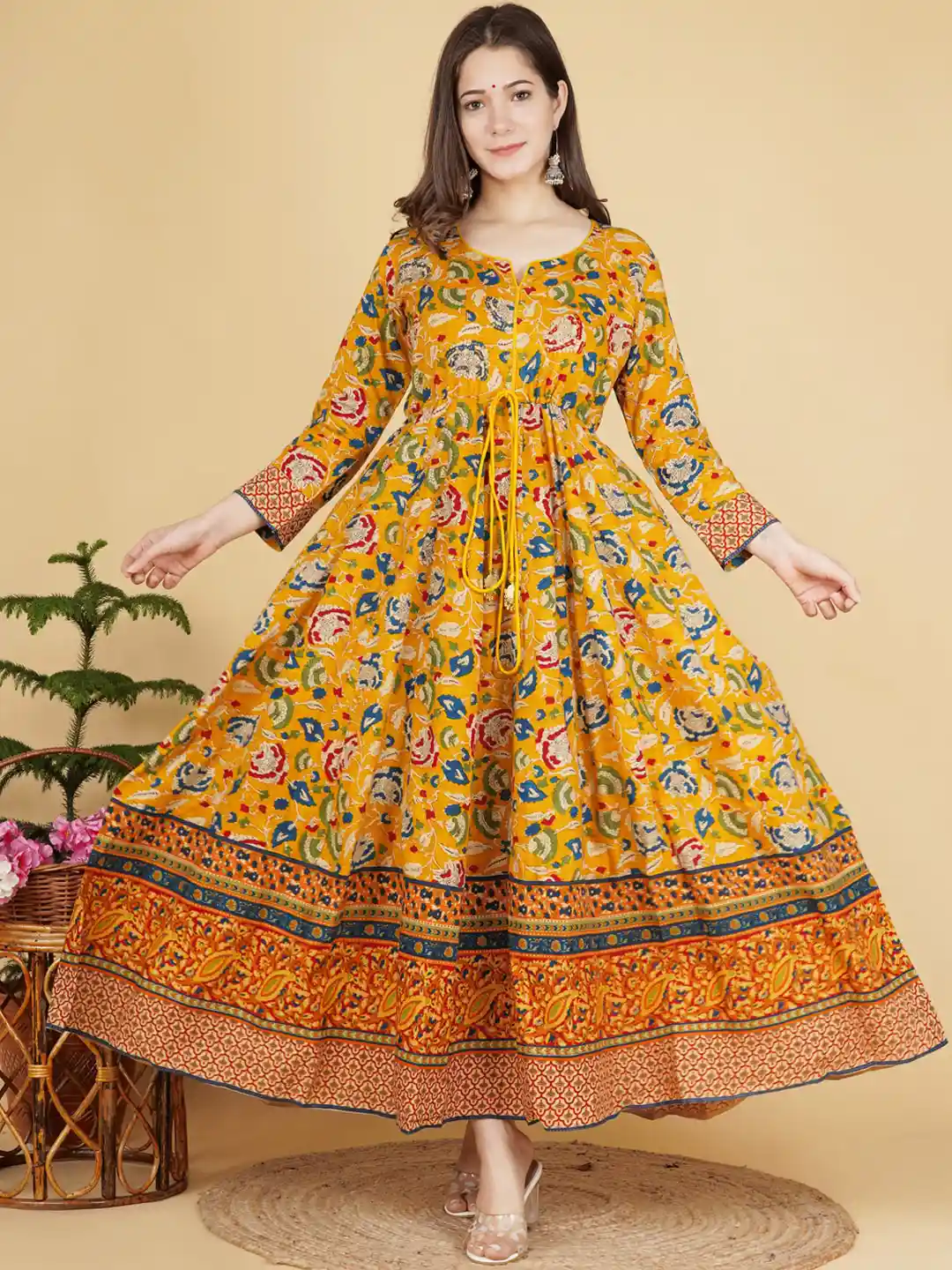 mustard yellow ethnic dress Mustard magic This article showcases a stunning mustard yellow traditional outfit designed with intricate silver embroidery and mirror work. The long flowy frock-style dress is paired with a matching dupatta, making