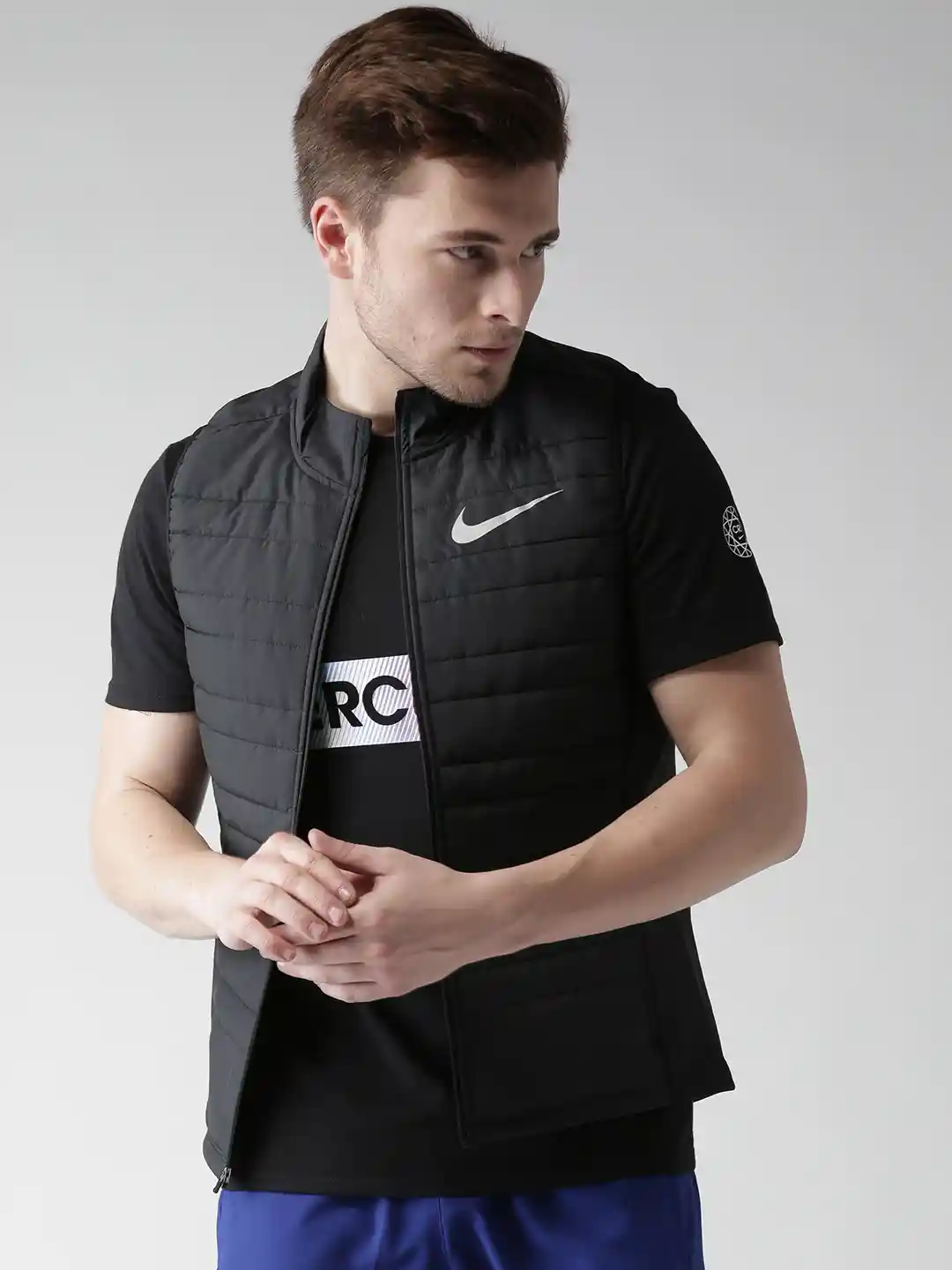 Buy Nike Men Black AS FIlled Essential Solid Sleeveless Insulator