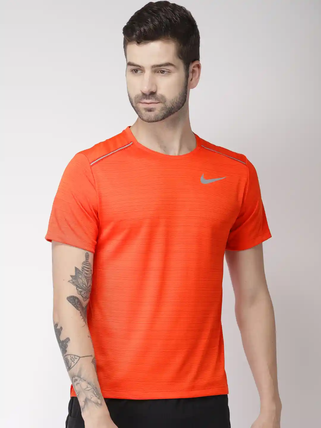 Buy Nike Men Orange Solid Standard Fit Round Neck MILER DRI-FIT