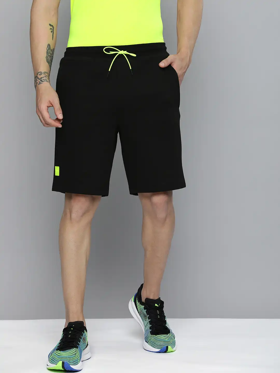 Buy one8 x PUMA Men Black Solid Virat Kohli Sports Shorts - Shorts
