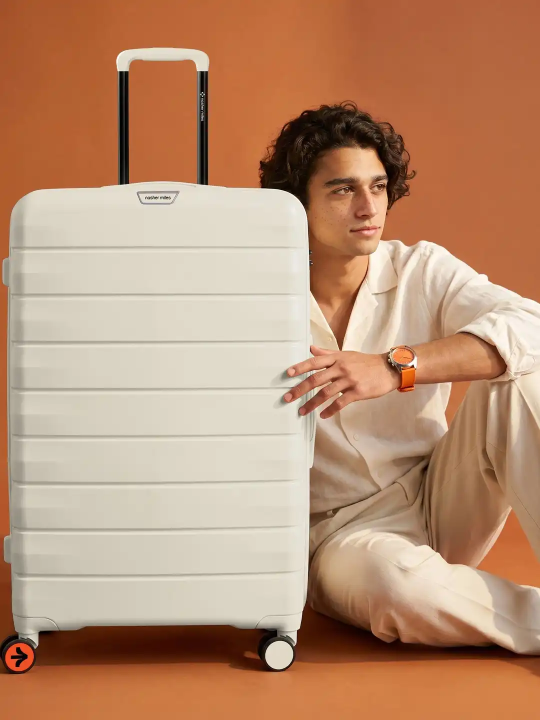 28 inch suitcase next to person