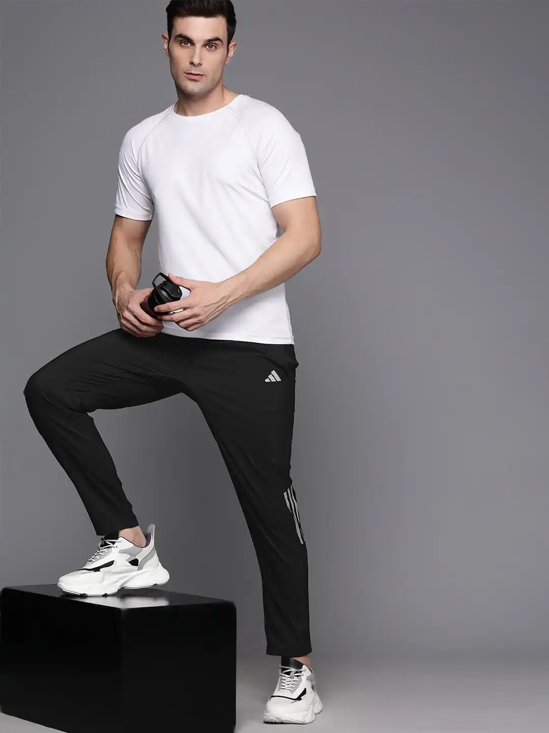 Buy ADIDAS Men Own The Run Woven Astro Track Pants - Track Pants