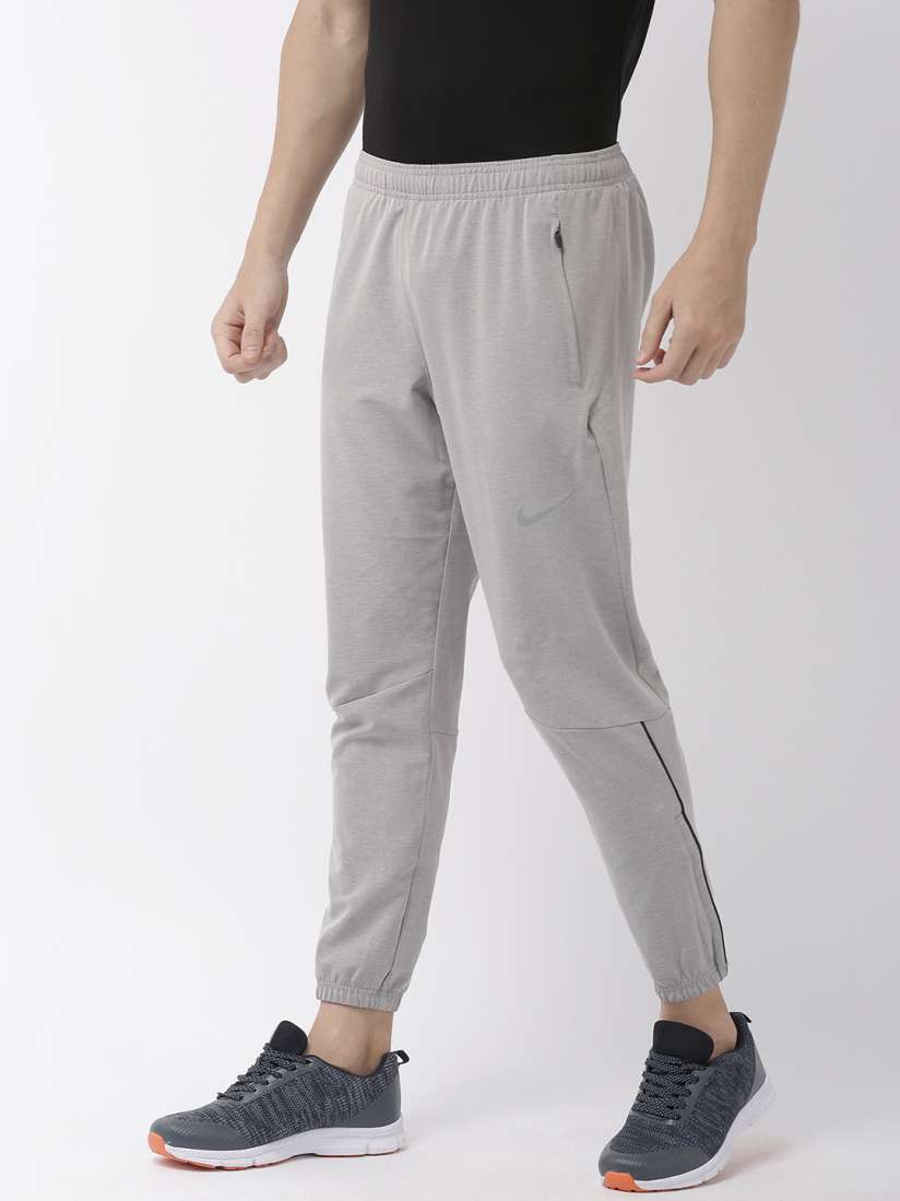Buy Nike Men Grey Dri Fit Solid Straight Fit Essential Woven Running Joggers Track Pants for Men 11233200 Myntra