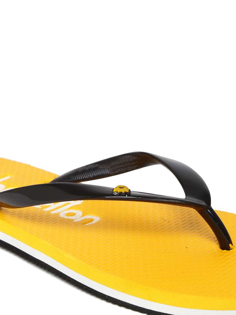 Black and yellow flip flops discount