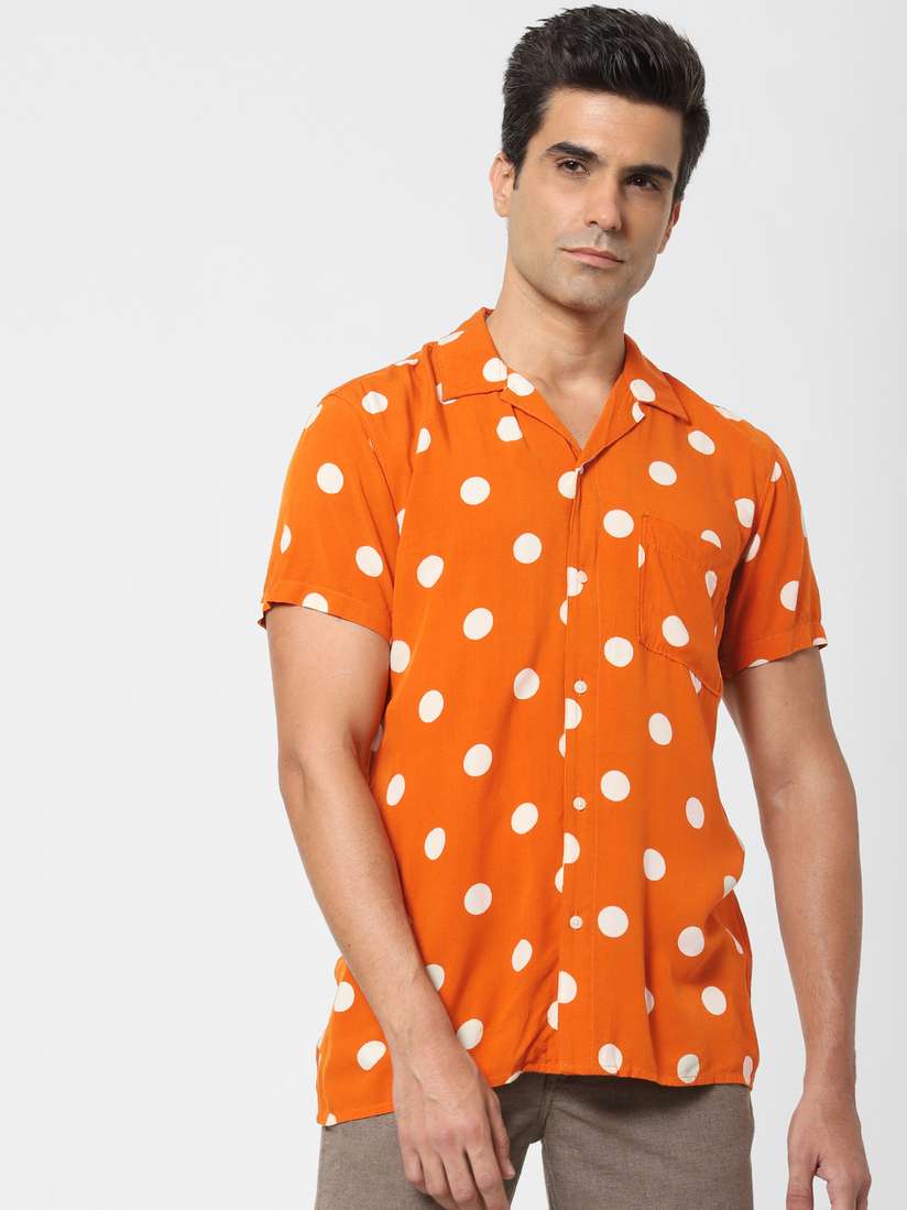 orange and white polka dot shirt