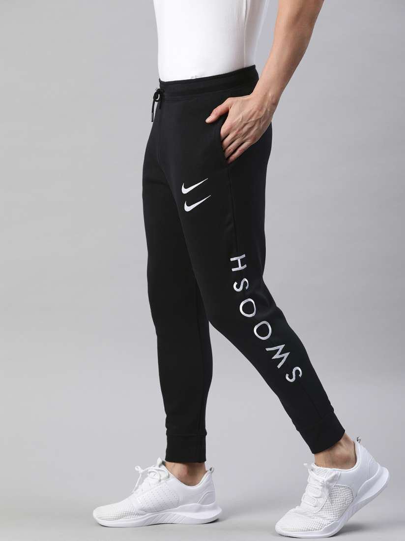 Buy Nike Men s Black and White Printed Track Pants Track Pants for Men 13325226 Myntra