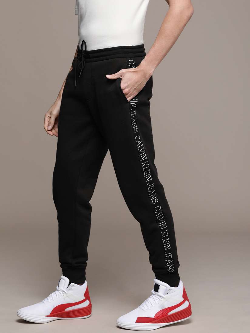 Buy Calvin Klein Jeans Men Black Solid Side Logo Taped Joggers Track Pants for Men 15151716 Myntra