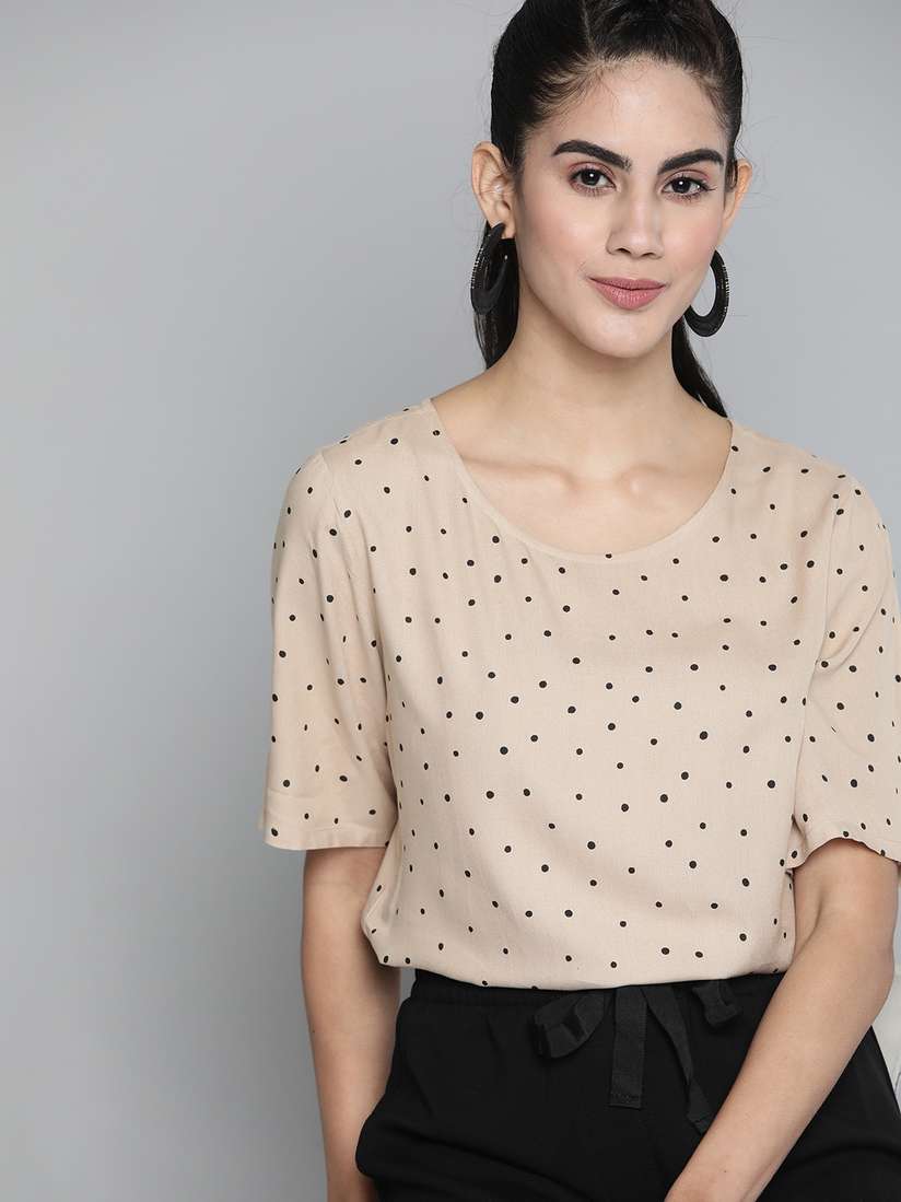 beige polka dot top