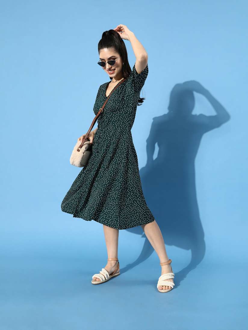 Green and black polka dot dress shop