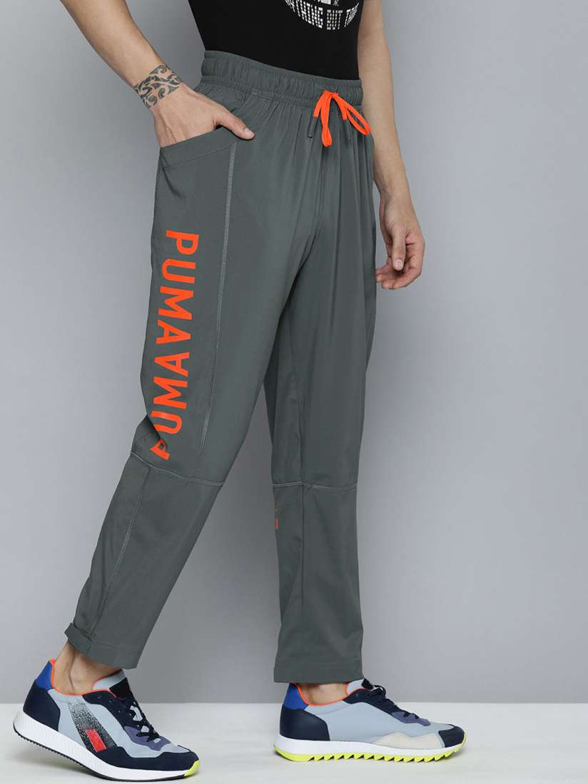 Buy Puma Men Grey Orange Logo Woven Printed Training Sustainable Sustainable Track Pant Track Pants for Men 16704222 Myntra