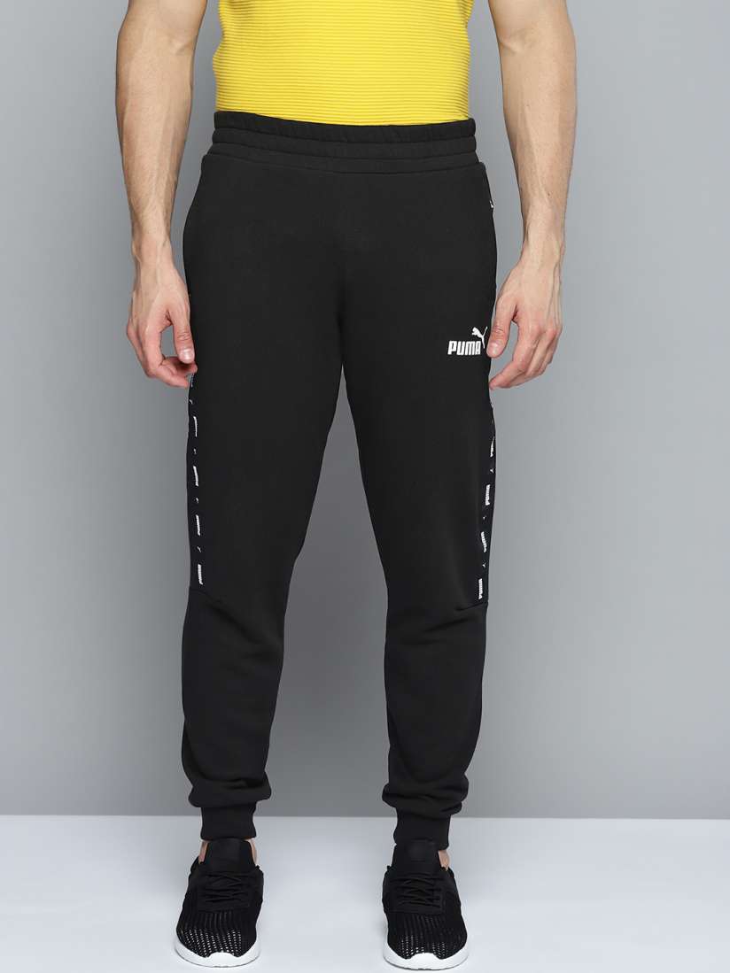 Buy Puma Men Black Bramd Logo Printed Essential Mid Rise Sustainable Regular Fit Joggers Track Pants for Men 17174312 Myntra