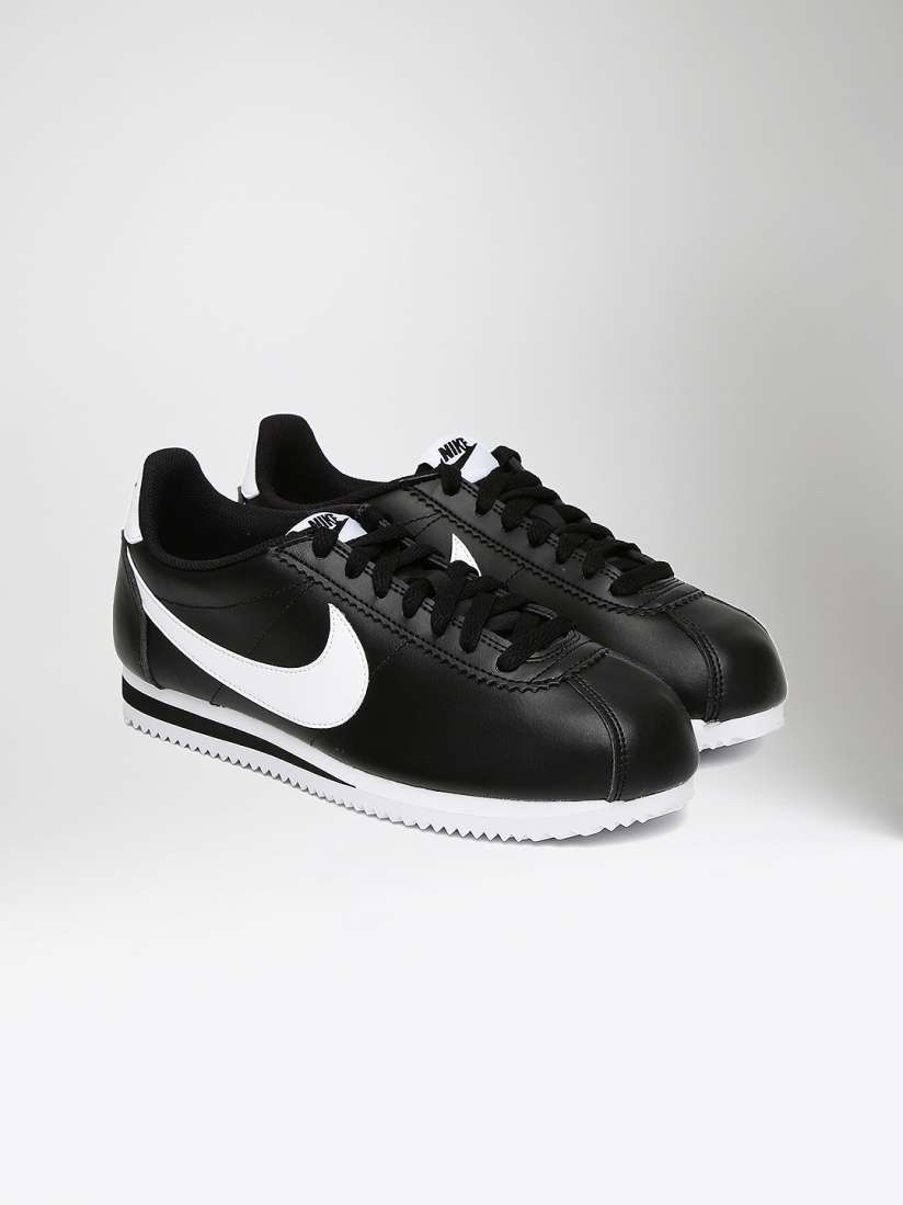 Solid black nike cortez discount