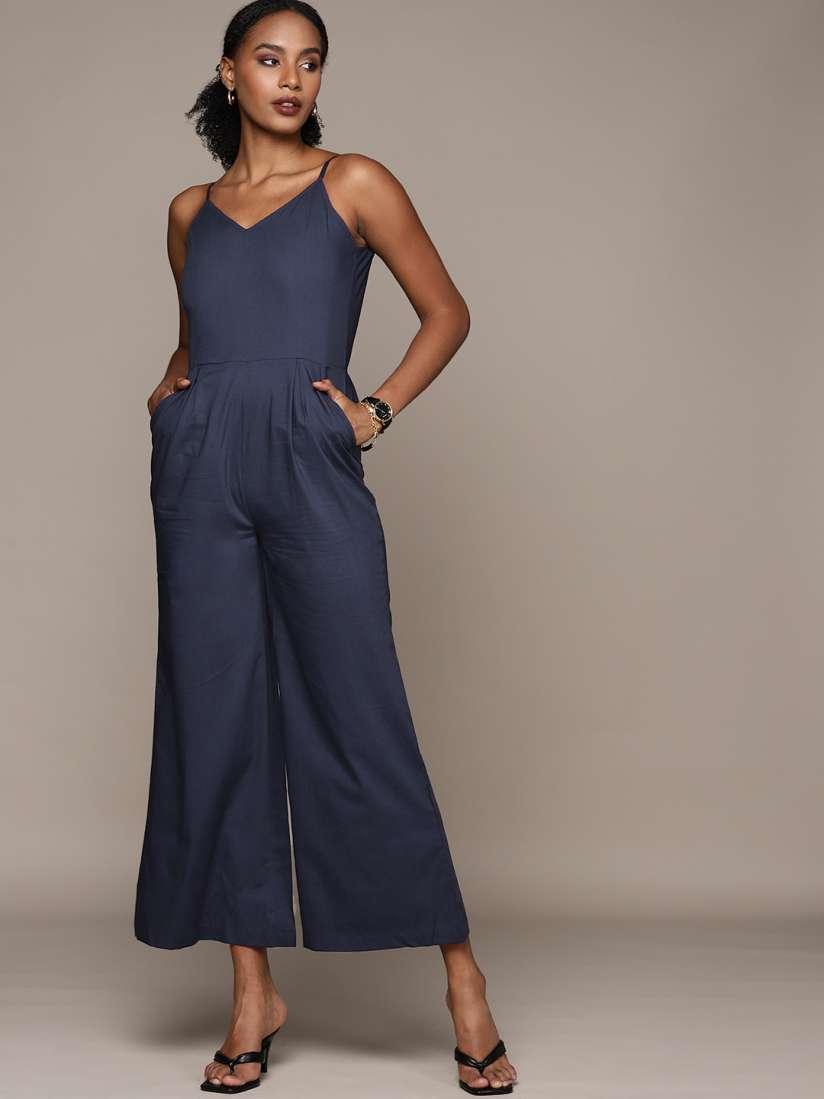 Bebe blue jumpsuit new arrivals