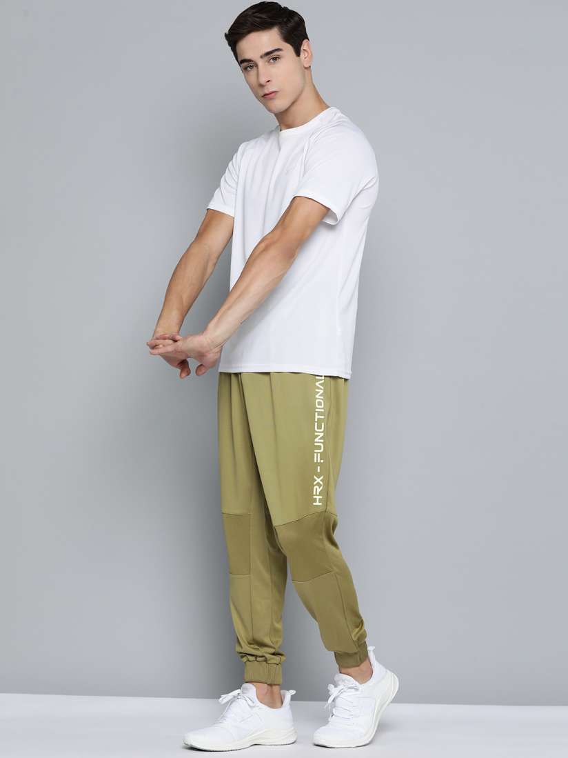 Buy HRX By Hrithik Roshan Training Men Rapid Dry Solid Joggers Track Pants for Men 17859308 Myntra