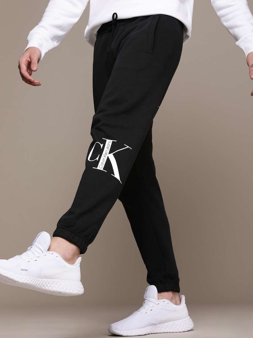 Buy Calvin Klein Jeans Black Brand Logo Printed Mid Rise Casual Joggers Track Pants for Men 19533260 Myntra